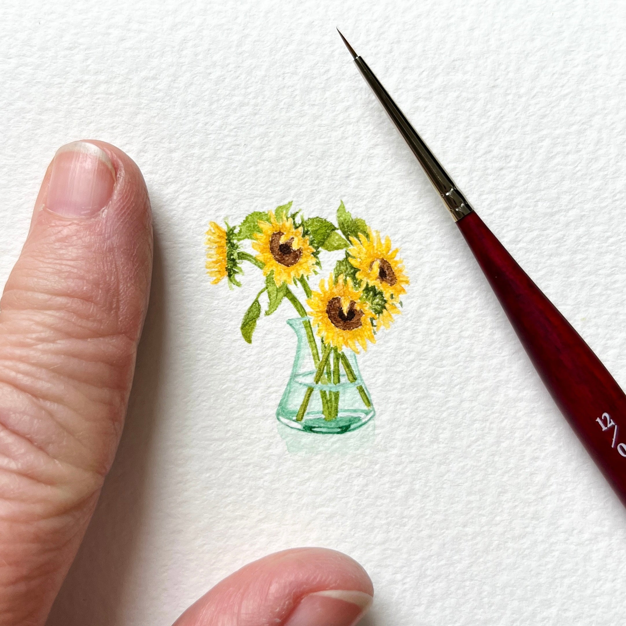 Vase of sunny sunflowers